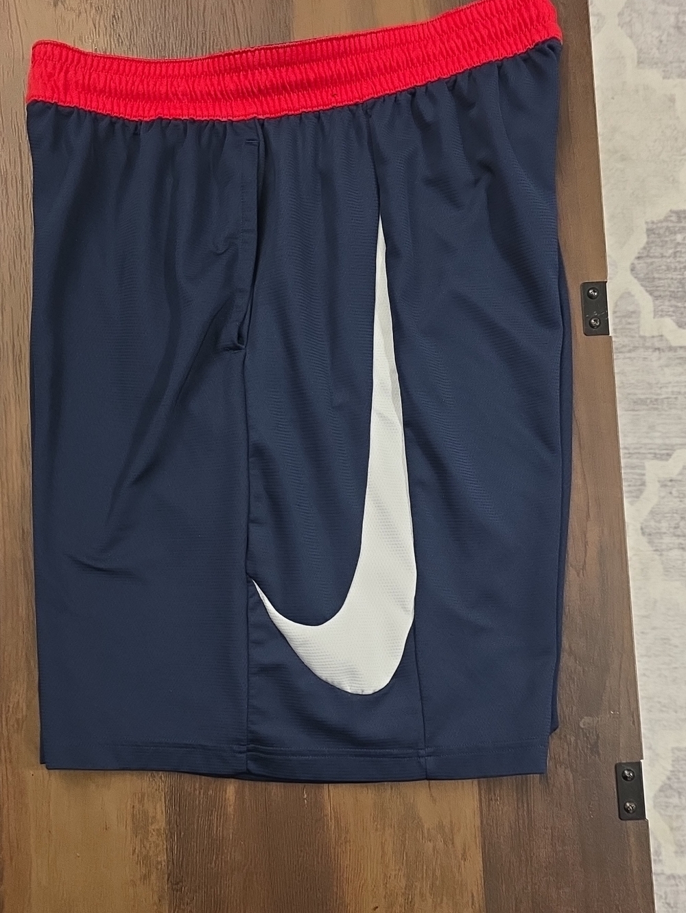 Nike Navy Shorts with Red Waistband and White Swoosh Accent